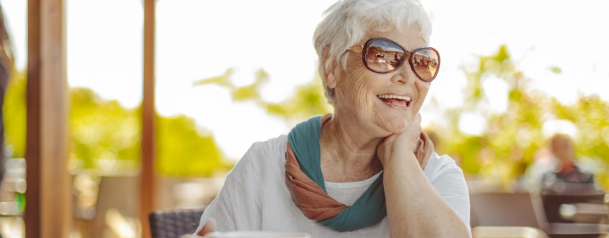 Life Assure Senior Enjoying Coffee On Vacation Hero